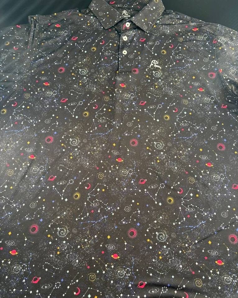 Rhoback constellation-print performance golf polo, one of our current in-stock pieces