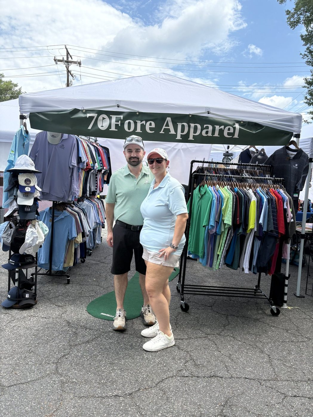 Katie and Andrew, co-founders of 70Fore Apparel, sourcing and prepping inventory